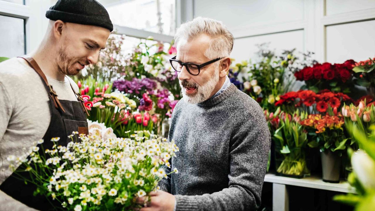 Men negotiating in flower shop