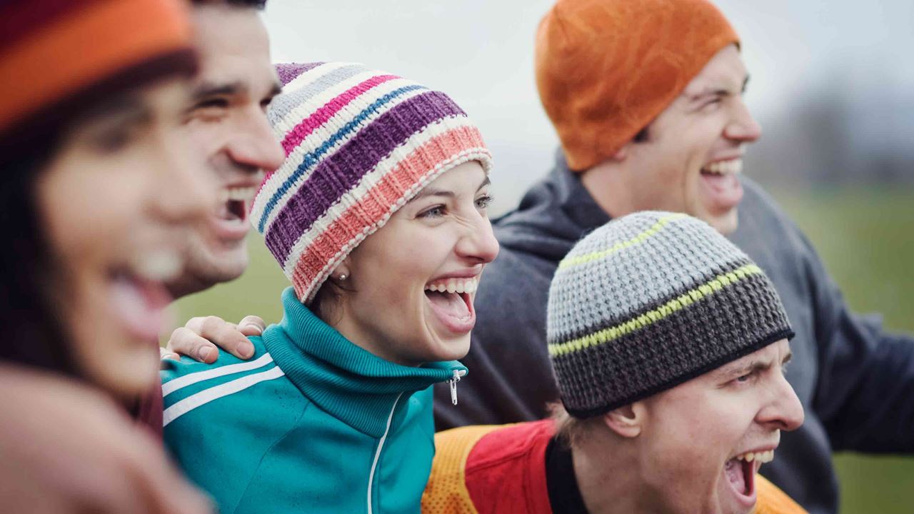 group of friends in colourful beanies