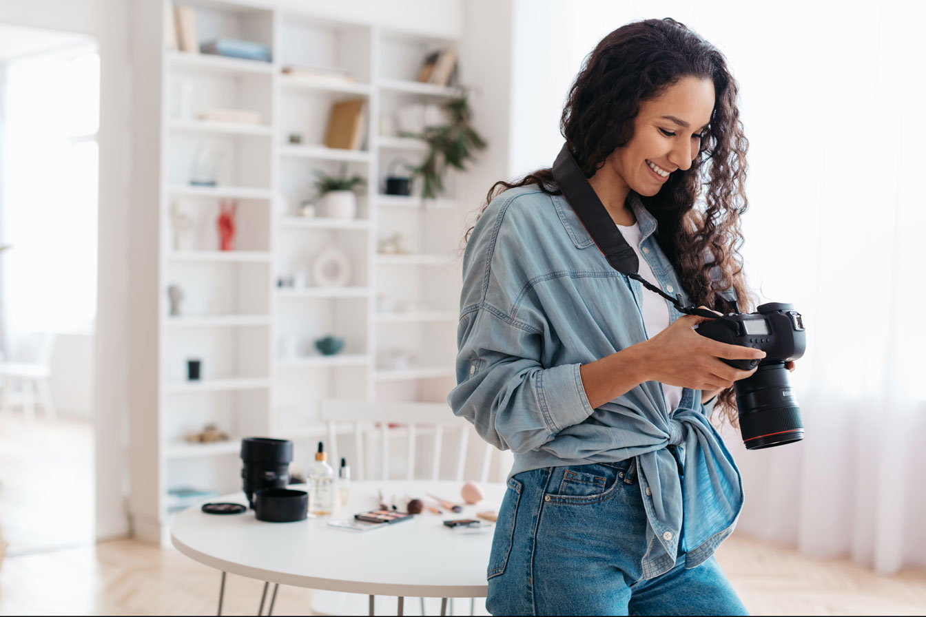 Young professional woman photographer 