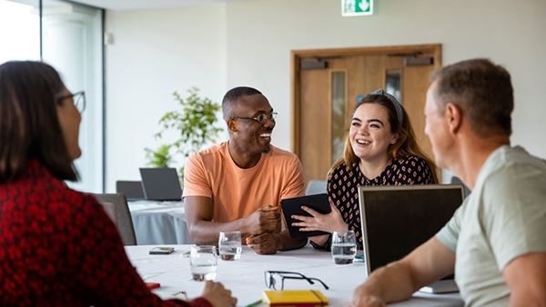 smiling colleagues in office